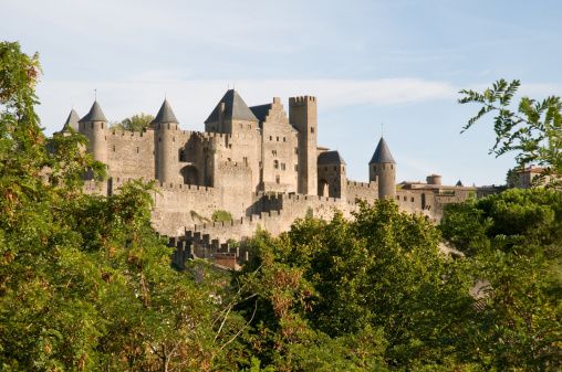 Ghent, Belgium - July 7, 2022: Gravensteen Castle in central Ghent, Belgium lit up in the early evening.