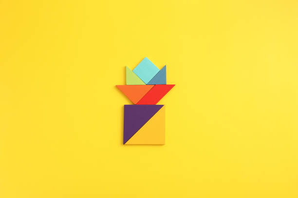 Wooden blocks flower isolated in yellow background
