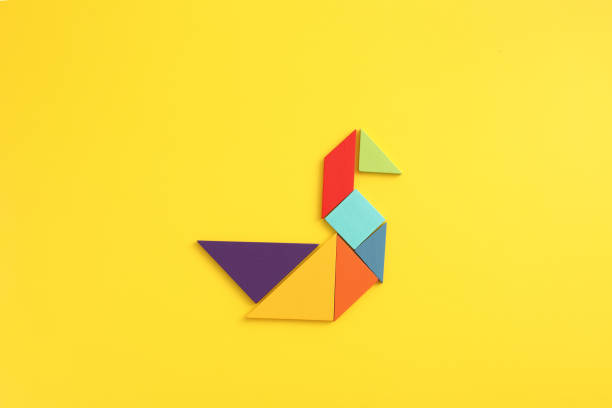 Wooden blocks duck isolated in yellow background