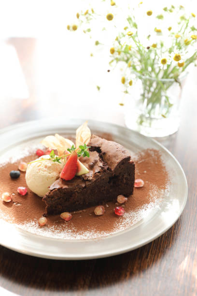 istock Chocolate cake with ice cream dessert on wood table 1470979650