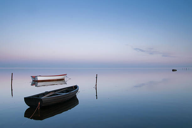 istock two boats on calm evening 147098060