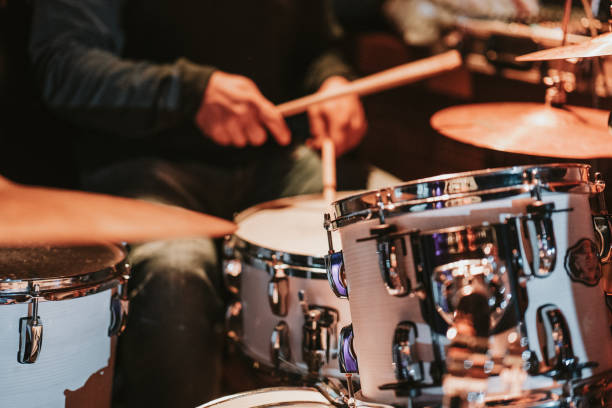 istock Man playing the drums during a concert, no faces are shown 1470983545