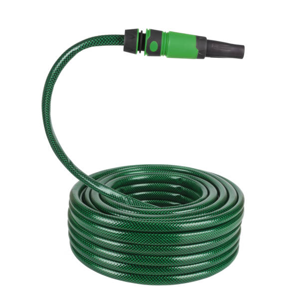 Coiled flexible tube watering garden hose hosepipe with sprayer isolated on white background stock photo