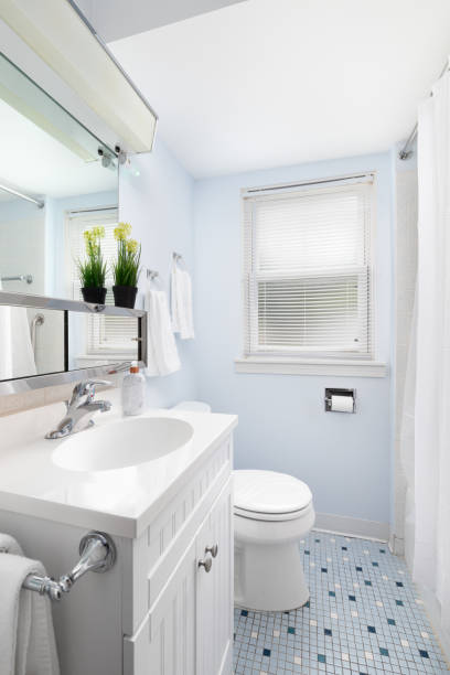 istock A bathroom with blue walls and blue tile floor. 1470985687