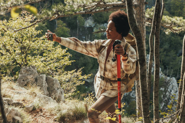 istock Woman Taking Selfie While Hiking On Mountain 1470985751