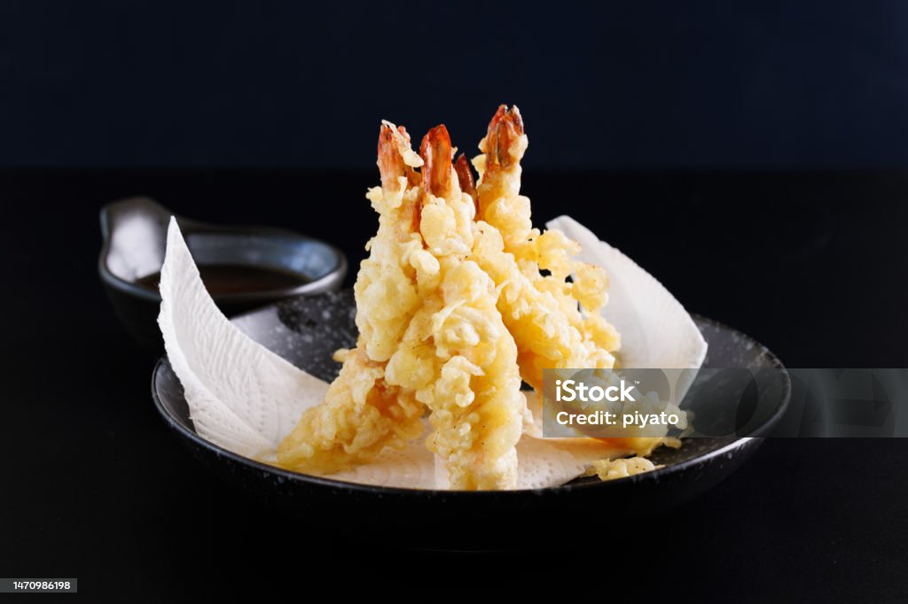 Shrimp tempura Japanese food isolated on a black background Ebi Nigiri Stock Photo