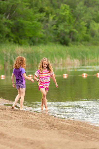 istock Girls Playing at Beach on Summer Day 1470989797