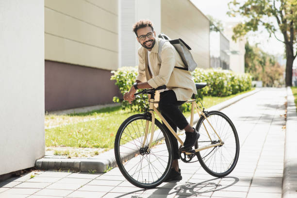 istock Handsome young man with bicycle in a city 1470989813