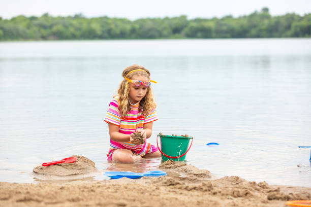 istock Girl Playing at Beach on Summer Day 1470989821