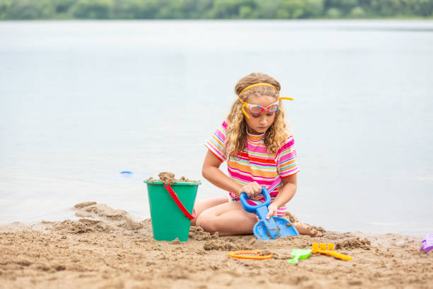 istock Girl Playing at Beach on Summer Day 1470989833