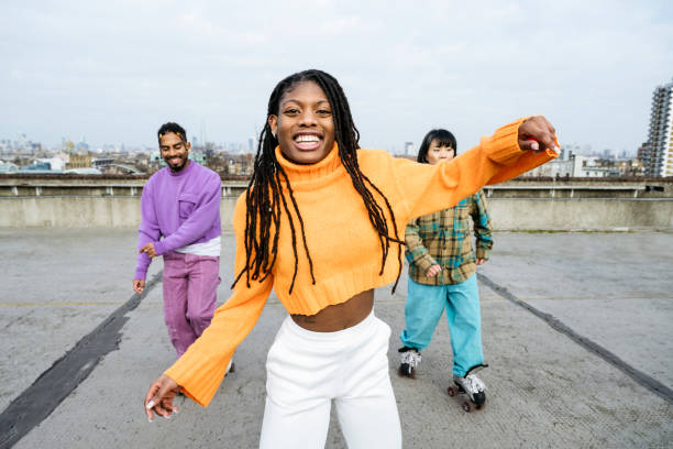 Young Black woman and roller skating friends