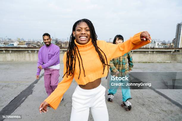 Young Black Woman And Roller Skating Friends Stock Photo - Download Image Now - Dancing, Portrait, People