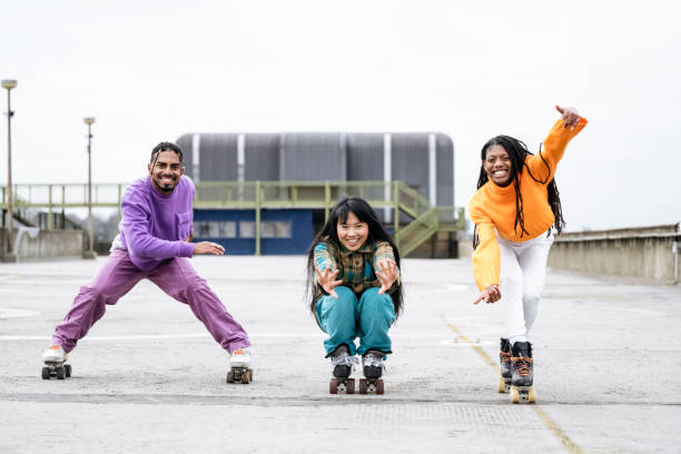 istock Candid action portrait of cheerful roller skaters 1470990180
