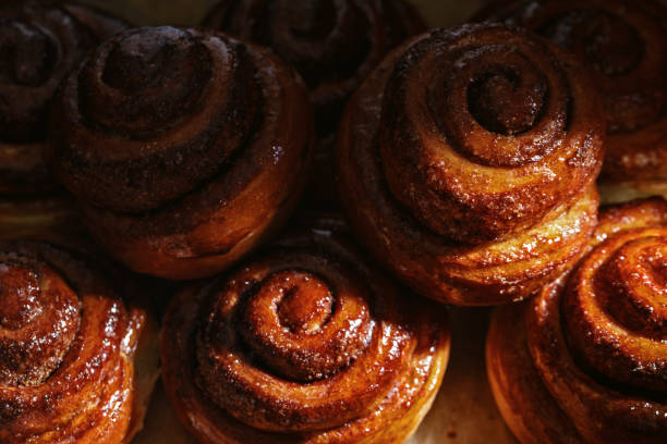 istock Freshly baked homemade Cinnamon rolls or Cinnamon buns on baking paper 1470991318