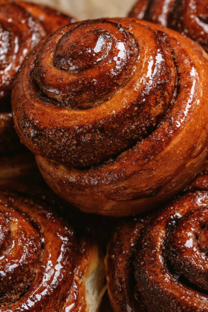 istock Freshly baked homemade Cinnamon rolls or Cinnamon buns on baking paper 1470991322