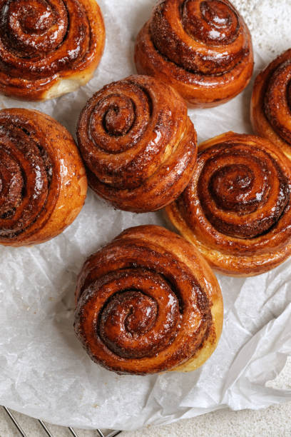 istock Freshly baked homemade Cinnamon rolls or Cinnamon buns on baking paper 1470991339