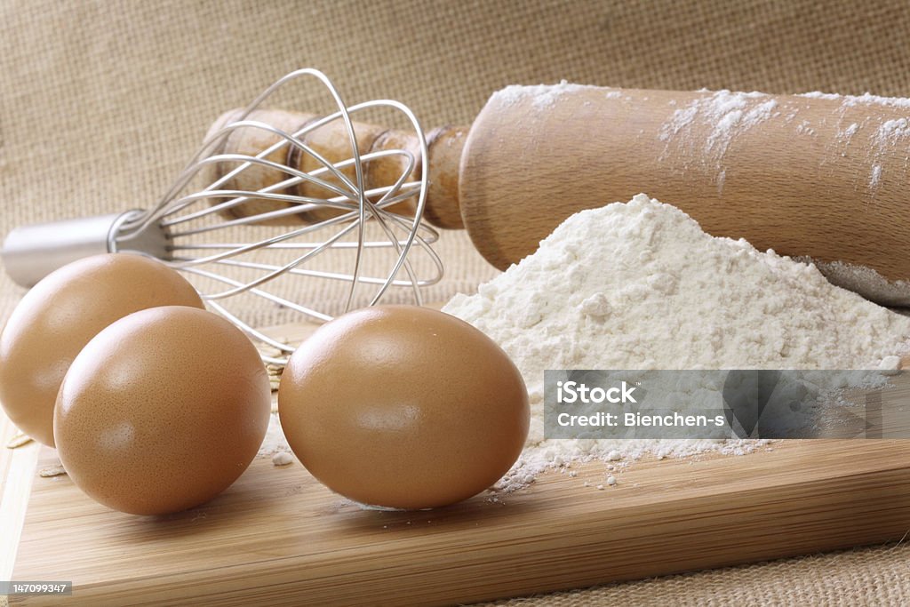 Ingredients to bake Ingredients to bake with Rolling Pin and Whisk Baking Stock Photo