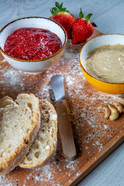 istock Strawberry and peanut compote with slices of bread. 1470994276