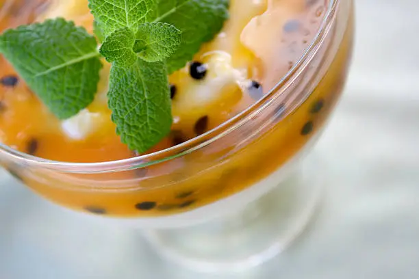 Close-up of passionfruit flavoured, frozen dessert.
