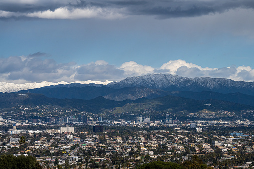 Low level snow blankets San Gabriel Mountains in Los Angeles after late winter storms.