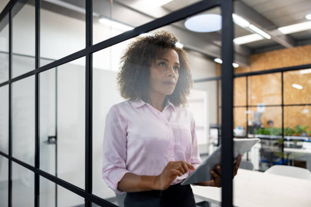 istock Business woman working at the office using a tablet computer 1470997216