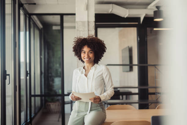 istock Beautiful woman standing in office 1470998338