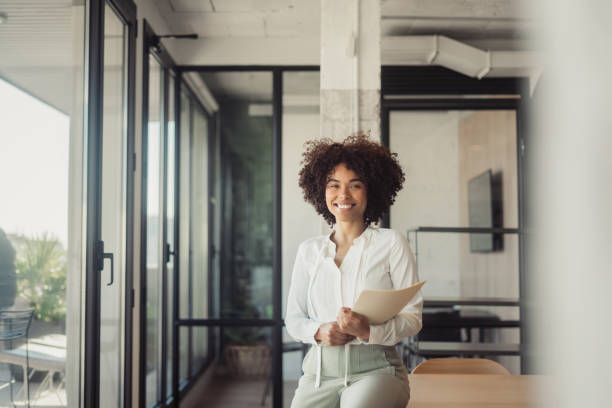 istock Beautiful woman standing in office 1470998346