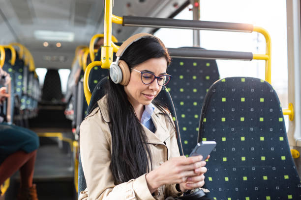 istock Woman using mobile phone at the public transport 1470998883