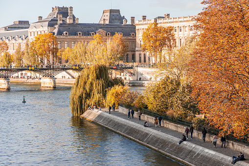 Square Barye and Ile Saint-Louis island on the Seine river in Paris, France in Autumn at sunset