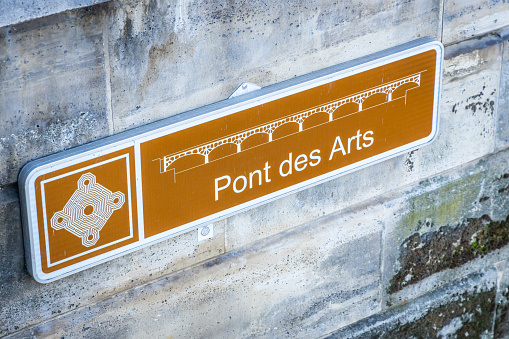 Pont des Arts sign on the bridge in Paris, France