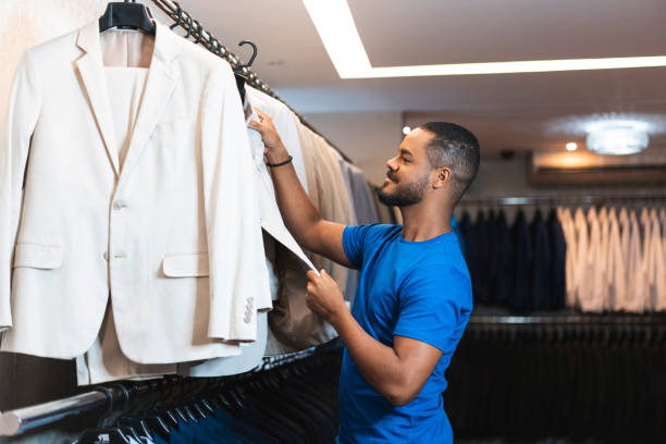 istock Young man at clothing store 1471003942