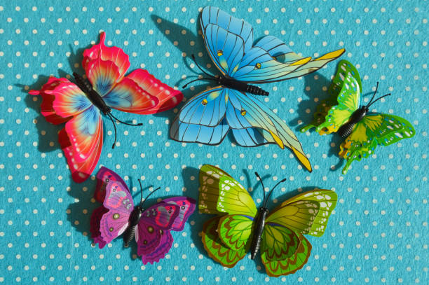 istock a bright butterfly on a colored abstract background for decoration. 1471004016