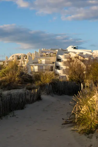 Photo of View of the buildings of the Couchant district from the dunes of the beach in La Grande-Motte