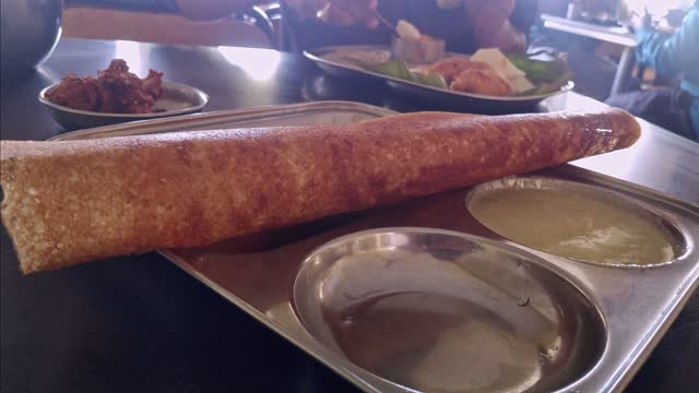 A closeup of the south Indian dish masala dosa served on a plate