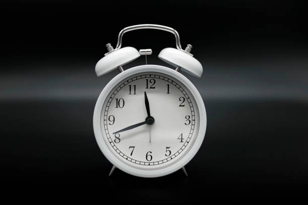istock Old Vintage alarm clock on dark background,time flowing concept,analog clock 1471010624