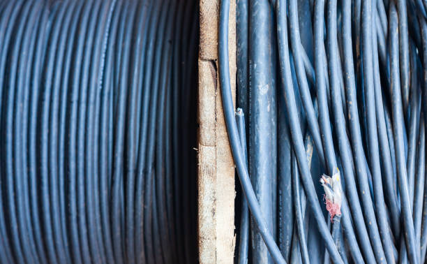 istock New high-voltage electrical cable wound on a wooden reel. 1471011518