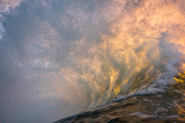 istock Unique ocean waves colliding in early morning golden light 1471013922