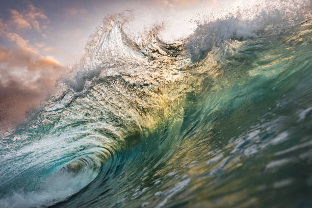 istock Unique ocean waves colliding in early morning golden light 1471013949