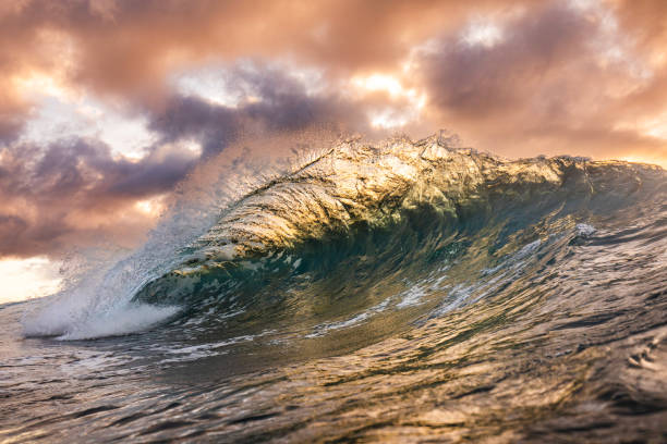 istock Unique ocean waves colliding in early morning golden light 1471013964