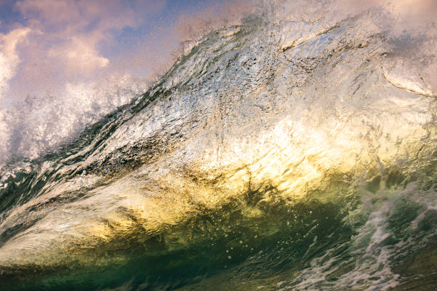 istock Unique ocean waves colliding in early morning golden light 1471013992