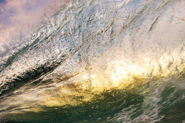 istock Unique ocean waves colliding in early morning golden light 1471013995