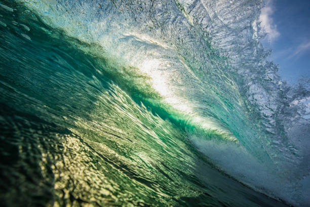 istock Unique ocean waves colliding creating pattern in early morning golden light 1471014641