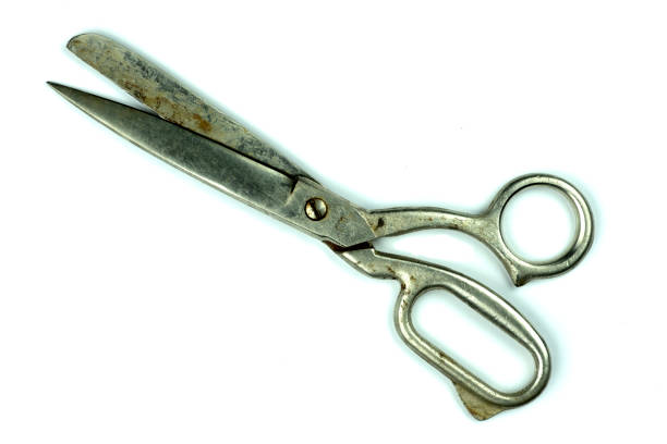 istock Old large scissors for cutting fabric, isolated on white background, space for advertising, 1471016963
