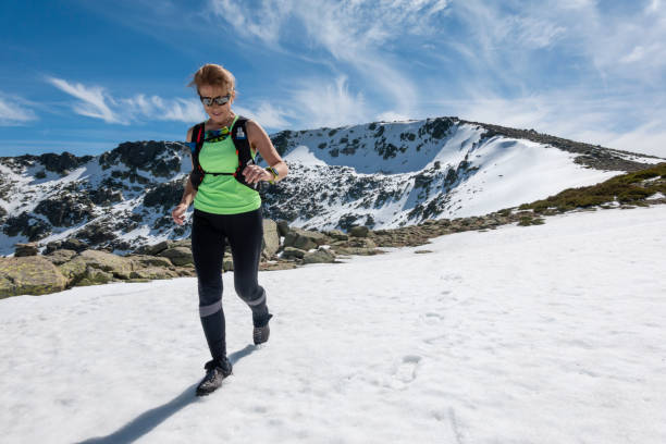 istock Hiker woman in snowy mountains 1471017503