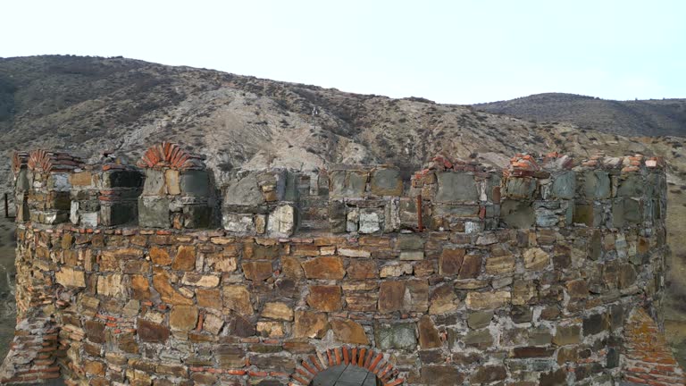 Aerial view of ancient tower at sunset. Close up