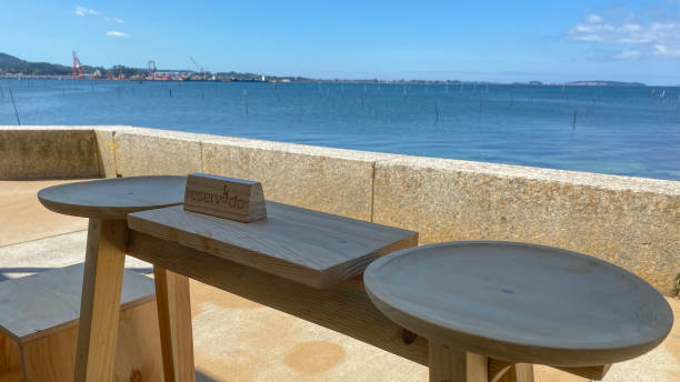 istock Empty wooden vintage table on a restaurant with sea background views 1471021775
