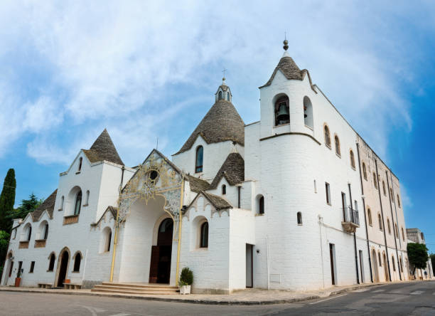 Church in trulli houses Alberobello beautiful old historic town (old Chiesa Sant'Antonio), Apulia region, Southern Italy.