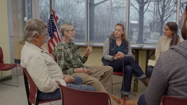 Senior male veteran shares about service experience during support group