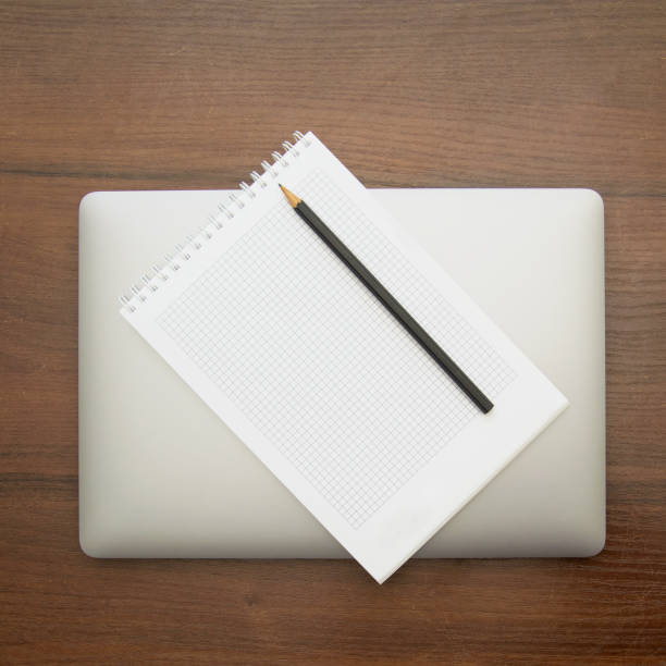 istock A beautiful pencil lies on a large notebook 1471025017
