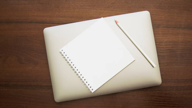 istock A beautiful pencil lies on a large notebook 1471025026